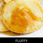 Close-up of fluffy Cottage Cheese Oat Pancakes drizzled with syrup, with text reading "Fluffy Cottage Cheese Oat Pancakes" at the bottom.