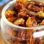 A glass dish filled with dried tomatoes.