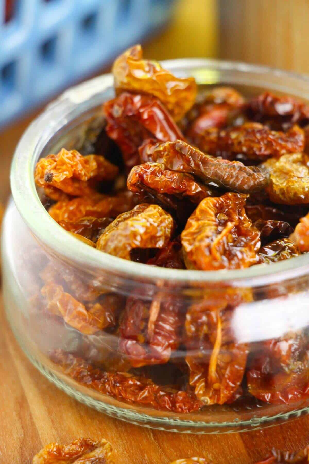 A glass dish filled with dried tomatoes.