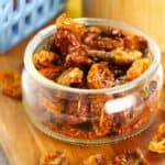 A dish of the condiment with fresh vegetables beside it.
