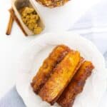 A white plate with caramelized pineapple.