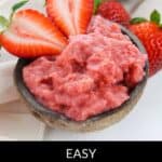 A bowl of creamy strawberry pudding topped with two fresh strawberry halves, surrounded by whole strawberries in the background. Text reads: "Easy Strawberry Pudding.