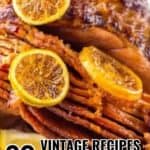 A close-up of a glazed ham garnished with lemon slices. Text overlay reads: "20 Timeless Recipes That Never Go Out of Style.