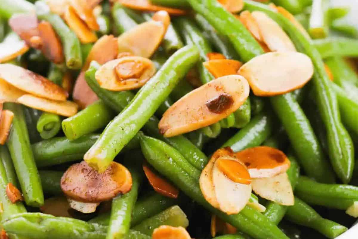This vibrant dish features crisp-tender green beans paired with golden toasted almond slices. The almonds add a buttery crunch and nutty flavor that perfectly complements the freshness of the beans. A simple yet elegant side that shines at any dinner table.