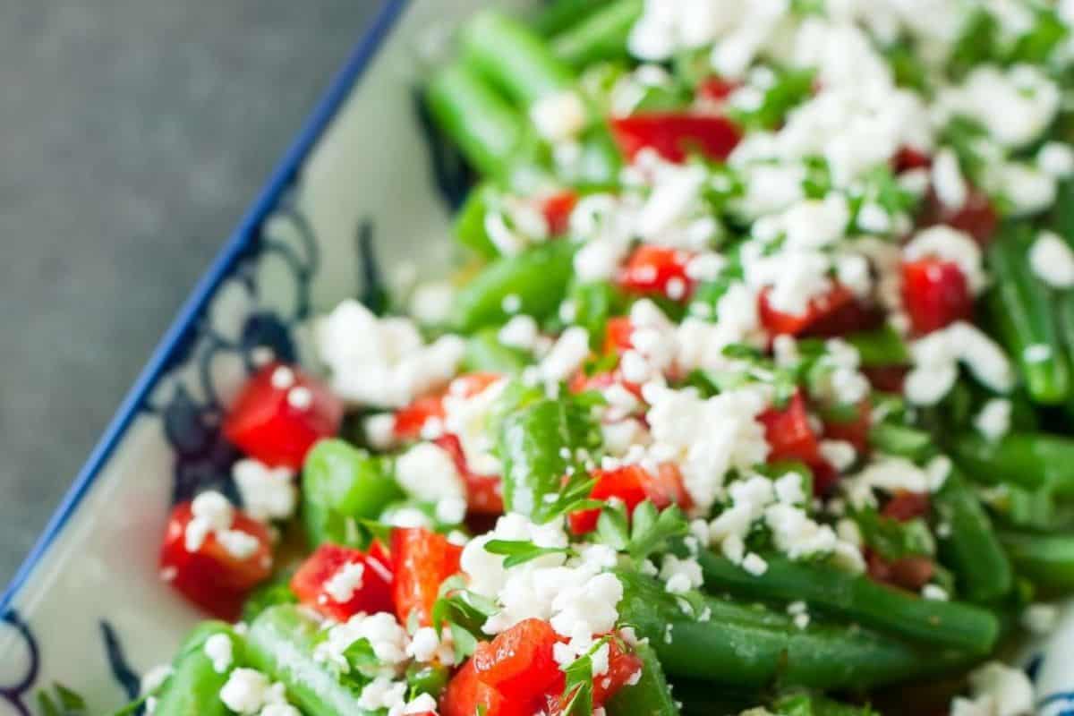 This Mediterranean-inspired salad is bursting with vibrant flavor thanks to crisp green beans, diced red peppers, fresh herbs, and a generous sprinkle of crumbled feta cheese. The contrasting textures and bold colors make it as appealing to the eyes as it is to the palate. Light, zesty, and perfect for entertaining.
