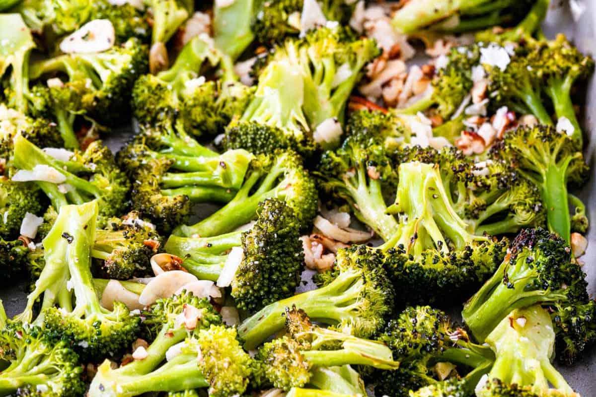 Delicious roasted broccoli florets topped with sliced almonds and grated cheese—a perfect addition to your list of broccoli recipes, even for picky eaters.