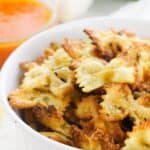 A white bowl of air fryer pasta chips.