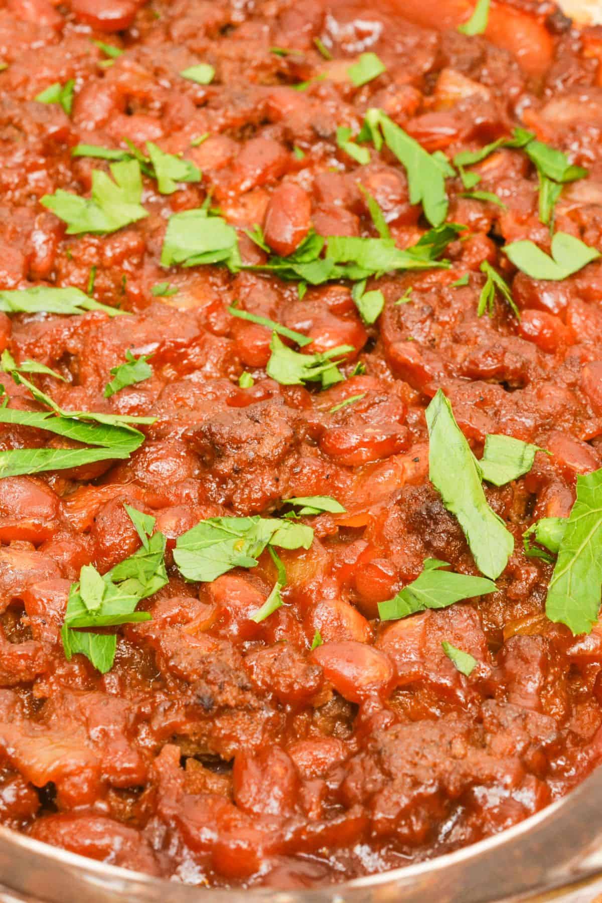 A close up of the meal with fresh herbs on top.