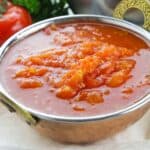 A close up of stewed tomatoes.