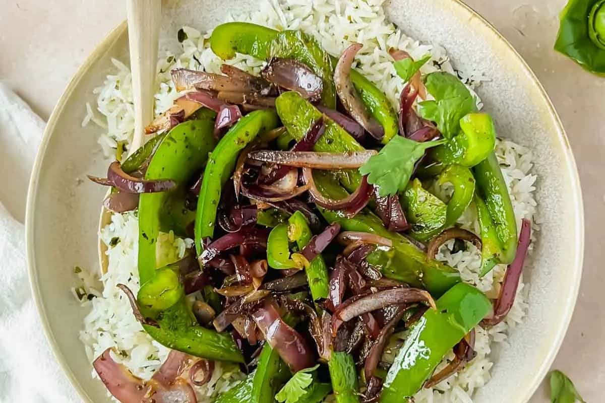 Sautéed Chipotle-style fajita veggies with sliced bell peppers and onions, cooked until tender with light char marks.