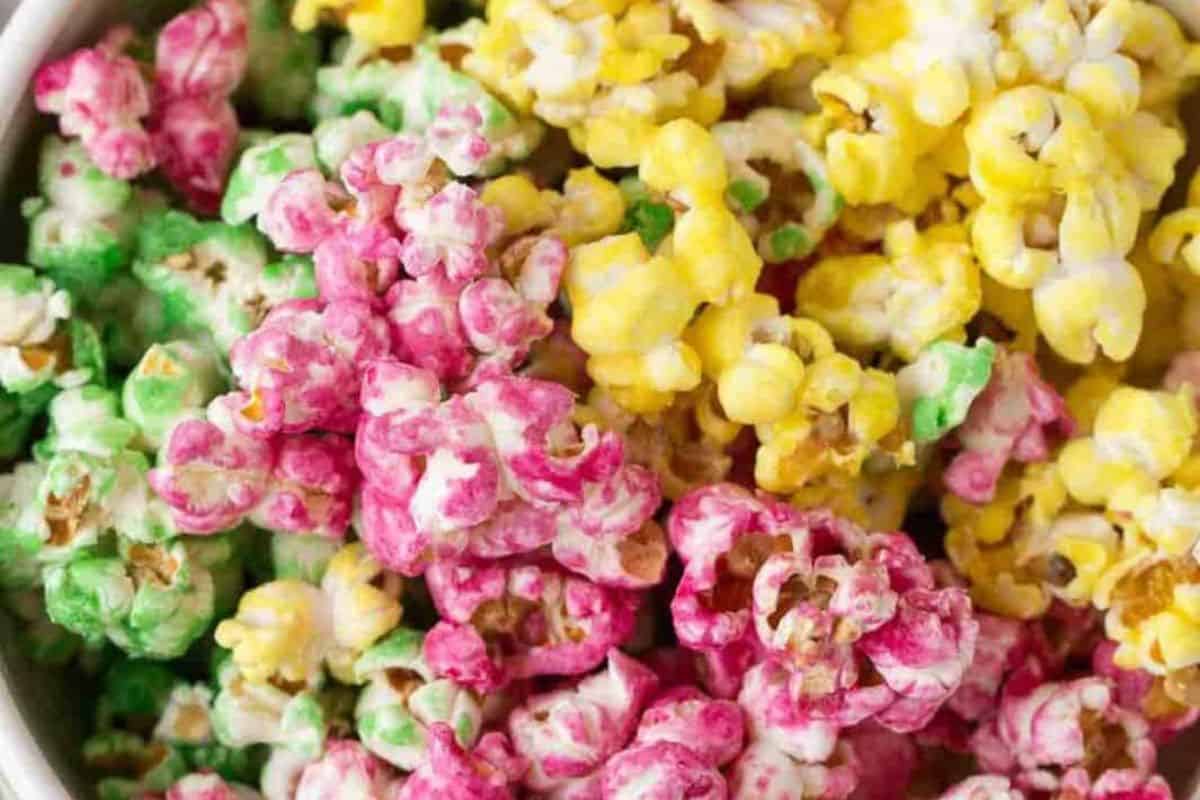 A close-up of a green, yellow and pink popcorn.