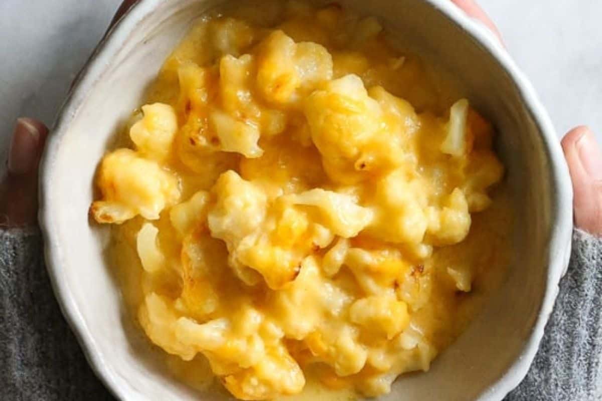 A bowl of baked macaroni and cheese with a golden, melted cheese topping.