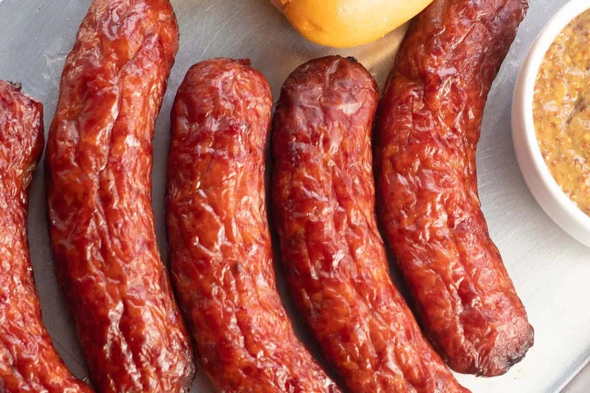 Smoked Italian sausage links with a browned, slightly charred exterior and juicy interior.