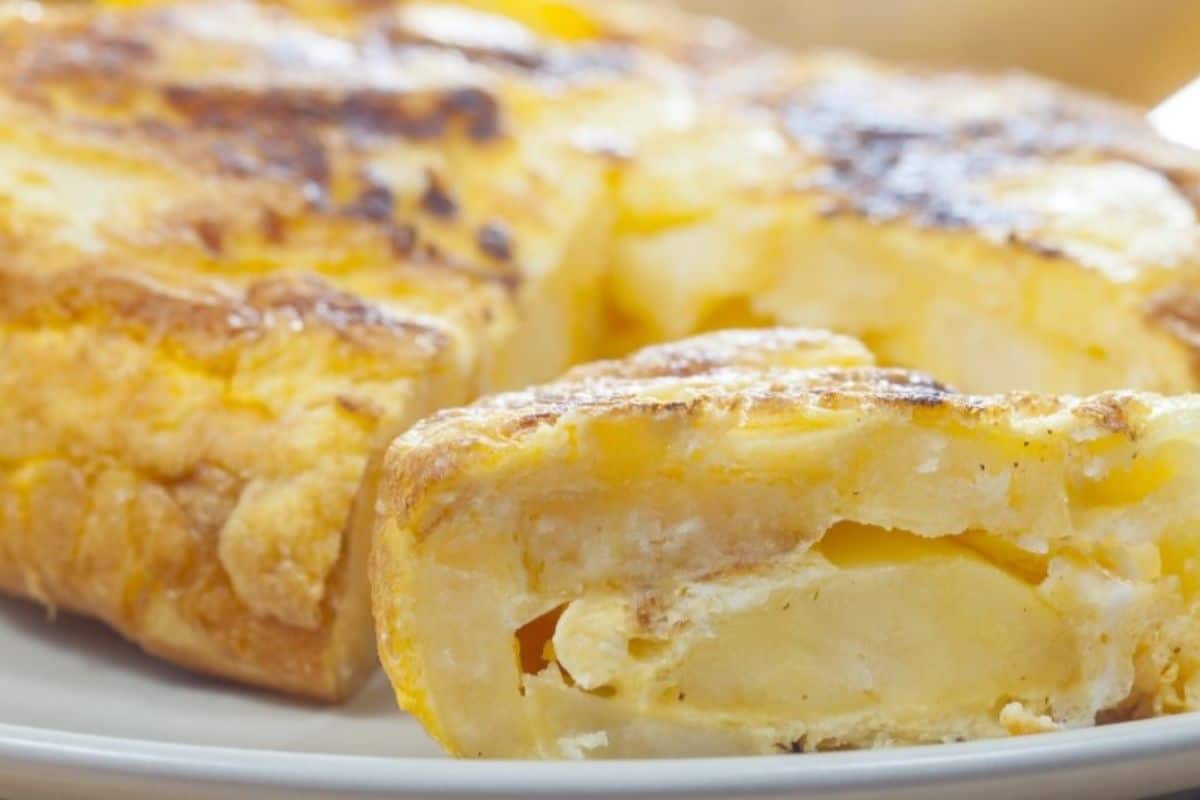 A close-up of a golden-brown omelette with a slightly crispy outer layer