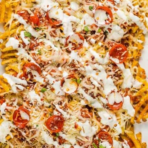 Waffle fries topped with melted cheese, mini pepperoni slices, herbs, and a drizzle of white sauce—this crazy good snack is a must-try for fans of bold flavor.