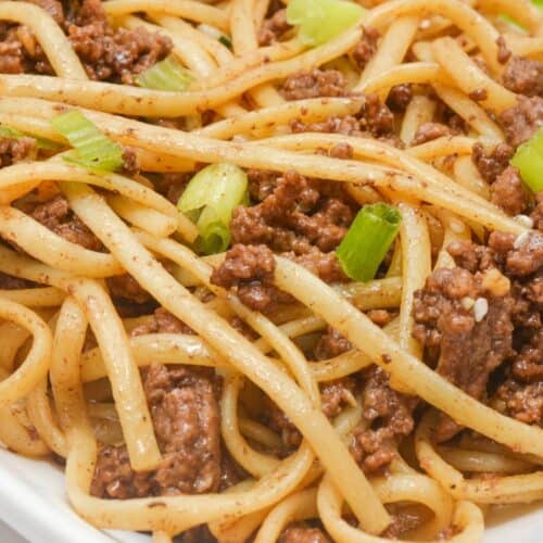 A plate of mongolian ground beef and noodles.