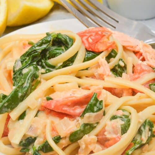 The salmon pasta with lemon on the side.