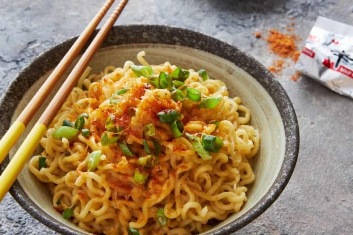 A bowl of noodles with chopsticks—perfect for those seeking easy ramen recipes or craving flavor packed ramen at home.