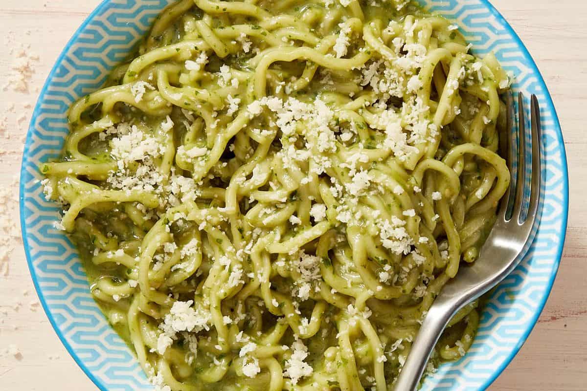 A bowl of flavorful ramen with a spoon.