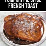 Three slices of Pumpkin Pie Spice French Toast sit on a silver plate, topped with a delicate sprinkling of powdered sugar.