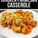 A serving of Chicken Parmesan Casserole topped with crispy breadcrumbs and fresh parsley is plated on a white dish.