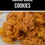 A plate of Cornflake Cookies coated in a caramel-colored mixture, stacked closely together. Text above reads "Easy Cornflake Cookies.
