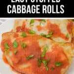 Two Easy Stuffed Cabbage Rolls topped with tomato sauce and chopped parsley are served on a white plate.