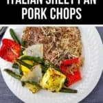 A white plate featuring Sheet Pan Pork Chops, surrounded by roasted green beans, red bell peppers, onions, and yellow squash for a colorful and flavorful meal.