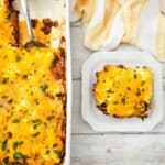 A serving of cheesy John Wayne Casserole with ground beef sits on a square plate next to a baking dish containing the rest of the casserole, garnished with parsley.