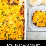 A baked John Wayne Casserole topped with melted cheese in a white dish, with a serving plated next to it; text reads "John Wayne Casserole.