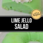 A classic Lime Jello Salad molded into a ring, topped with whipped cream and a maraschino cherry, served on a white plate.