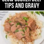 A plate of Slow Cooker Beef Tips and Gravy served over white rice, topped with rich brown gravy and garnished with chopped parsley.