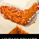 A slice of Vintage Tomato Soup Cake with white frosting is lifted on a spatula above the rest of the cake. Text at bottom reads "Vintage Tomato Soup Cake.