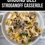 A plate of Easy Ground Beef Stroganoff casserole with egg noodles and parsley sits beside a recipe title banner on a light wooden surface.