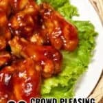 A plate of barbecue chicken wings on a bed of lettuce, with text overlay reading "20 Crowd Pleasing Party Food Recipes"—the perfect inspiration for your next party food recipes collection.