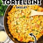 A delicious skillet recipe featuring creamy chicken tortellini, topped with fresh herbs and grated cheese. The dish is beautifully presented in a skillet with a wooden spoon, while text labels describe this comforting chicken pasta meal.